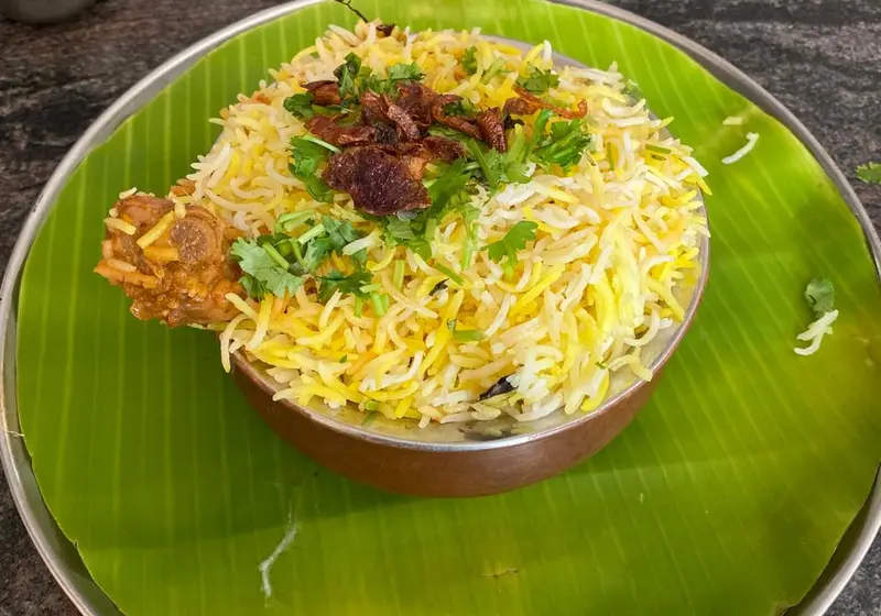 Yellow turmeric rice served on a banana leaf